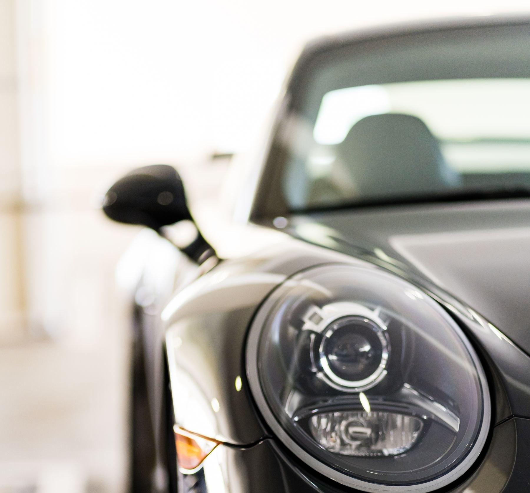 Close-up of a black car's headlight
